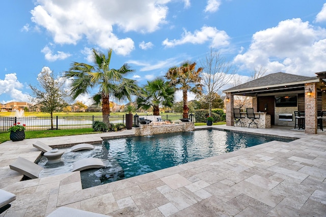 view of swimming pool with a patio, fence, a fenced in pool, and outdoor dry bar