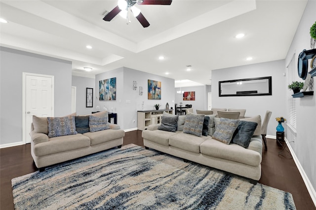 living area featuring recessed lighting, dark wood-style flooring, and baseboards