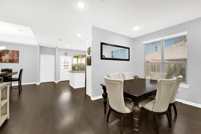 dining room with baseboards, dark wood-style flooring, and recessed lighting