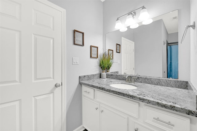 full bathroom with visible vents and vanity