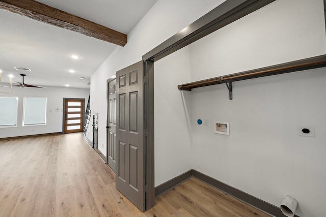 clothes washing area with laundry area, light wood finished floors, baseboards, hookup for an electric dryer, and washer hookup