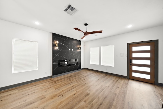 unfurnished room featuring visible vents, wood finished floors, and recessed lighting