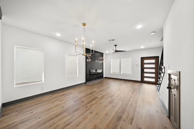 interior space featuring recessed lighting, light wood-type flooring, visible vents, and baseboards