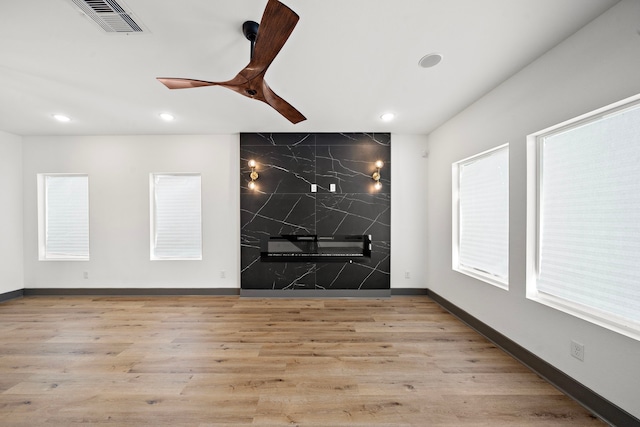 empty room featuring visible vents, baseboards, ceiling fan, wood finished floors, and recessed lighting