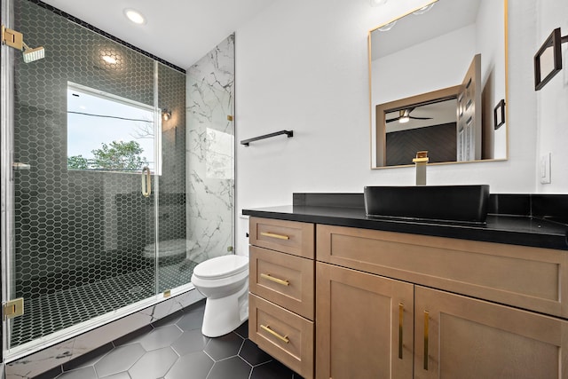 full bathroom featuring toilet, recessed lighting, vanity, a shower stall, and tile patterned floors