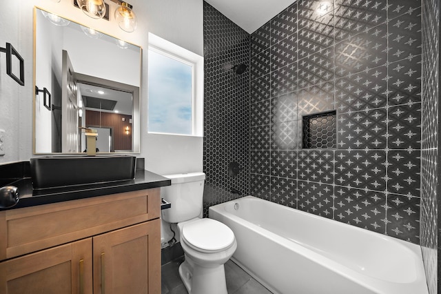 full bathroom with tile patterned flooring, tub / shower combination, vanity, and toilet