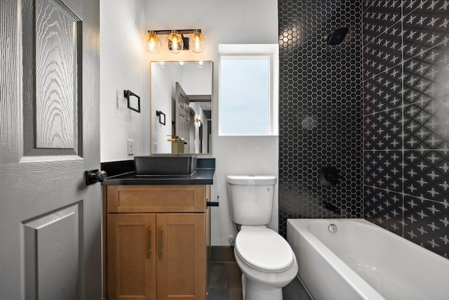 bathroom featuring toilet, shower / tub combination, and vanity