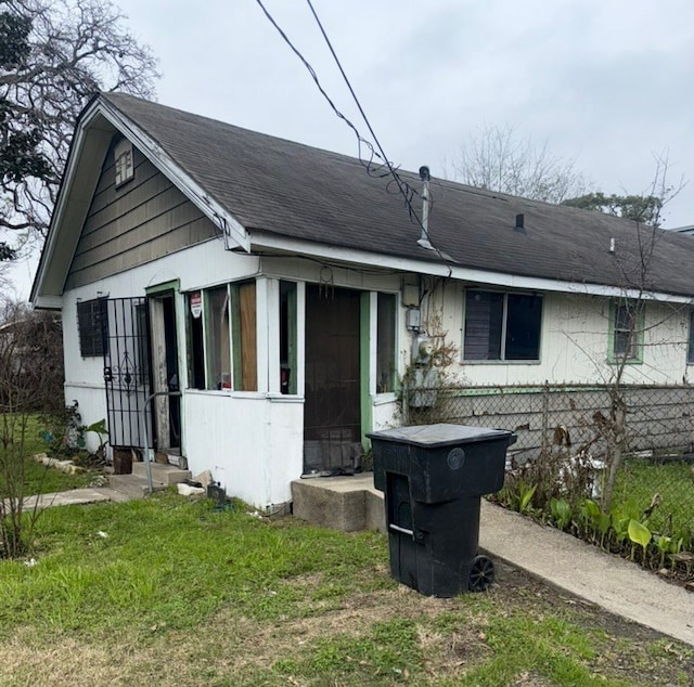 view of front of house with roof with shingles