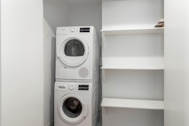 laundry area with stacked washer / drying machine