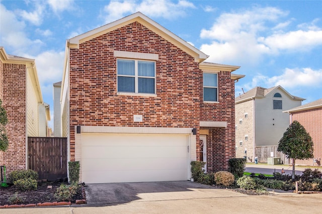 traditional-style home featuring a garage, driveway, brick siding, and cooling unit