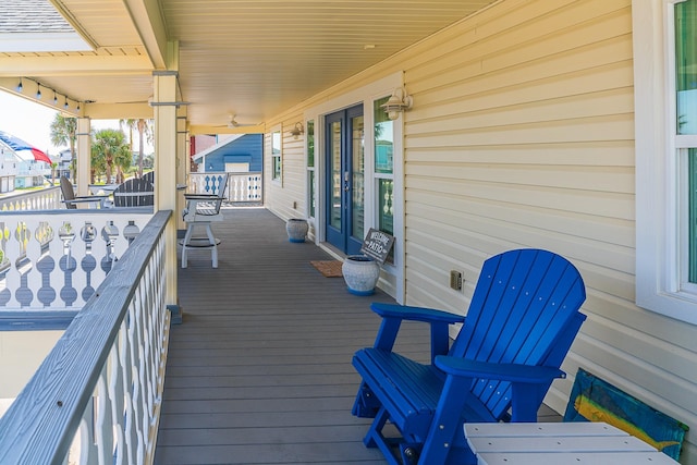 wooden terrace with a porch