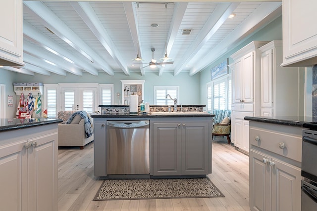 kitchen with light wood-type flooring, visible vents, dishwasher, and a sink