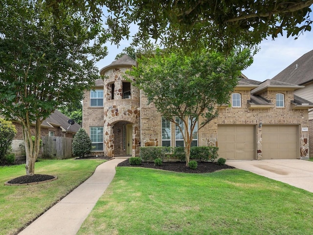 view of front of property featuring brick siding, fence, concrete driveway, stone siding, and a front yard