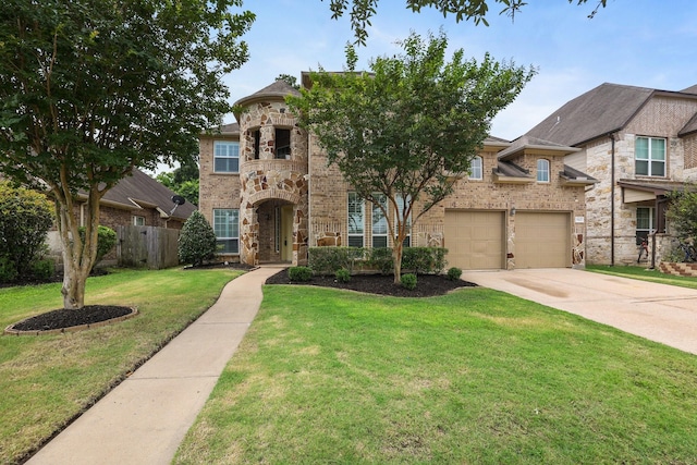 view of front of property with a garage, fence, a front lawn, and brick siding