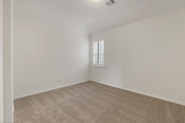 unfurnished room with baseboards, visible vents, and carpet flooring