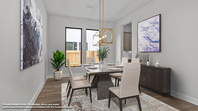 dining space with a chandelier, wood finished floors, visible vents, and baseboards