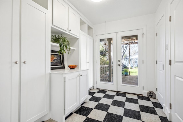 doorway with dark floors and french doors