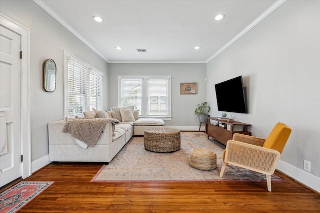 living room featuring ornamental molding, dark wood-style flooring, and baseboards