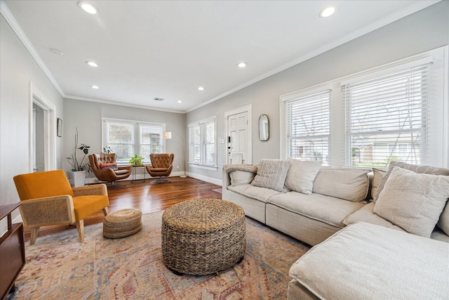 living area featuring ornamental molding, recessed lighting, baseboards, and wood finished floors