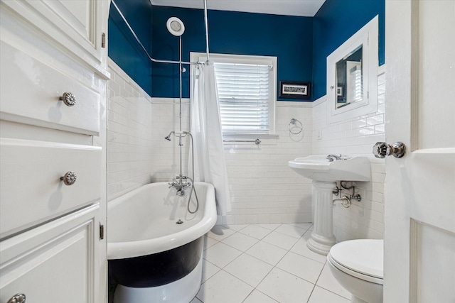 bathroom featuring a washtub, tile walls, a shower with shower curtain, toilet, and tile patterned floors