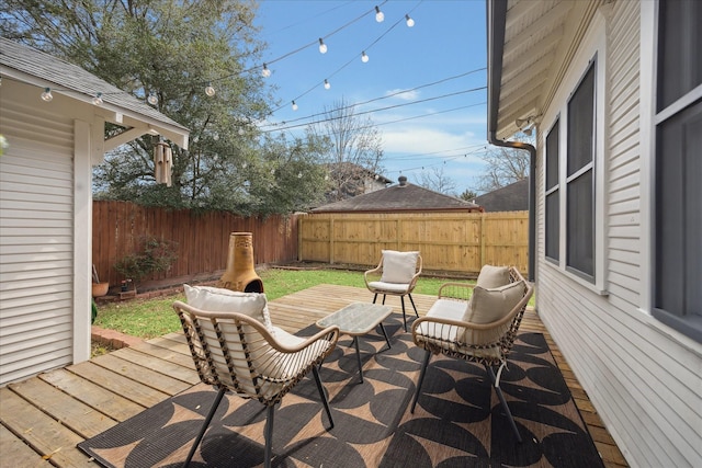 deck featuring a fenced backyard