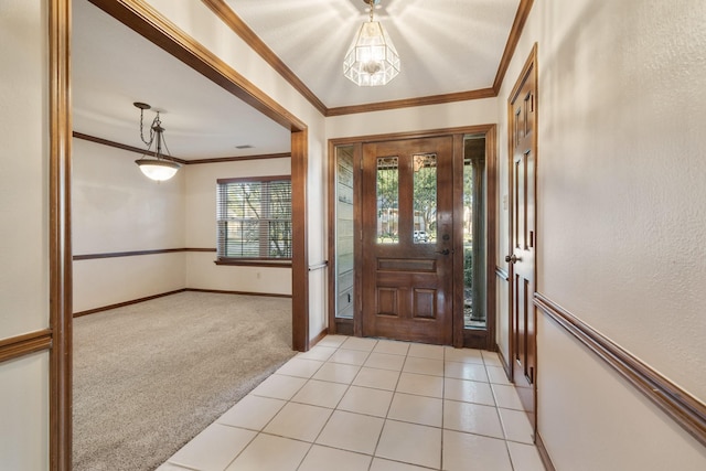 entrance foyer with light carpet, light tile patterned floors, baseboards, a textured wall, and crown molding