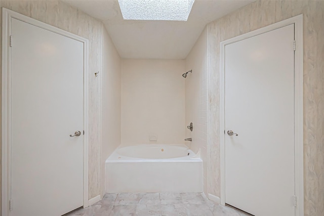 full bathroom featuring shower / bathing tub combination and a skylight