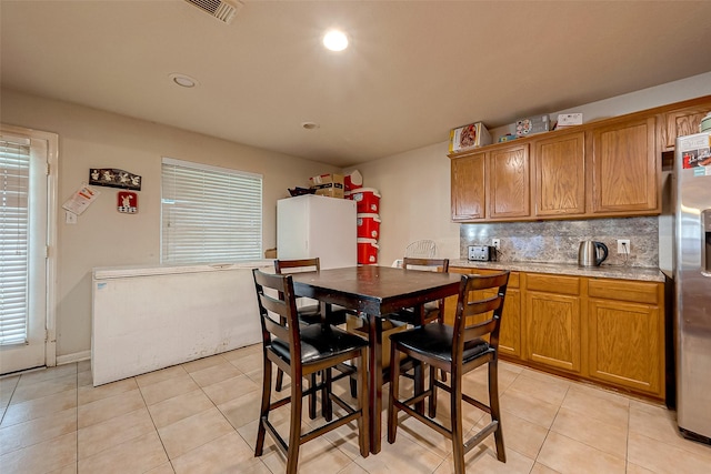 dining area featuring light tile patterned floors, visible vents, and recessed lighting