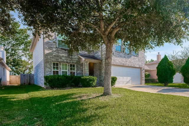 view of front facade with a garage, fence, concrete driveway, stone siding, and a front yard