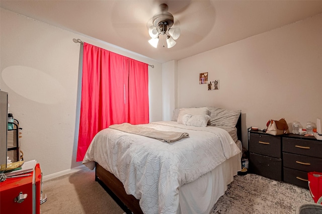 bedroom featuring carpet flooring, a ceiling fan, and baseboards