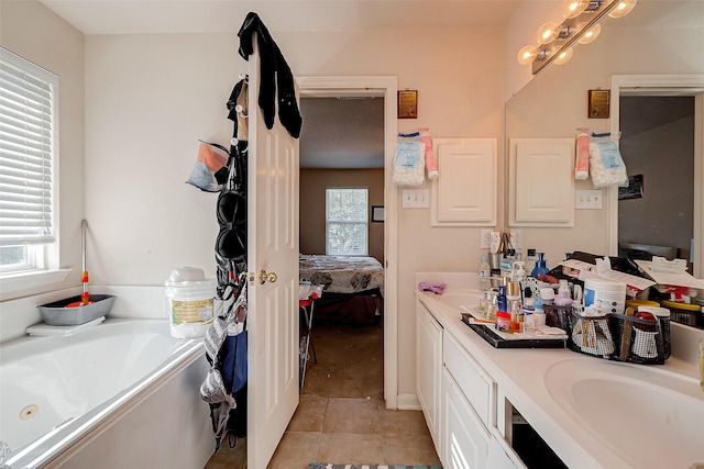 full bath featuring a jetted tub, a sink, double vanity, and connected bathroom