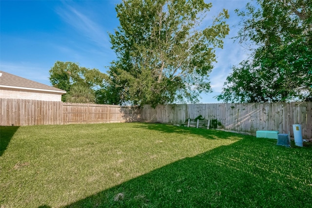 view of yard featuring a fenced backyard