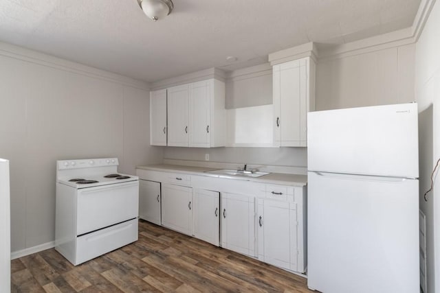 kitchen with white appliances, dark wood-style flooring, a sink, white cabinetry, and light countertops