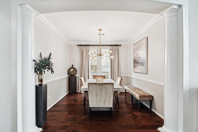 dining space with ornate columns, baseboards, dark wood finished floors, and crown molding