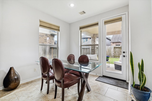 dining area featuring light tile patterned floors, baseboards, visible vents, and recessed lighting