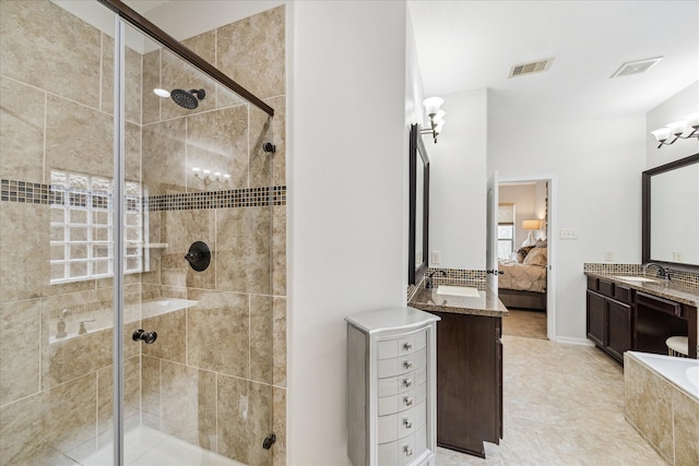 ensuite bathroom featuring a stall shower, ensuite bath, and visible vents