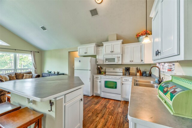 480 Caney Creek Dr, Livingston, TX 77351 - kitchen featuring white appliances, a sink, vaulted ceiling, and white cabinets