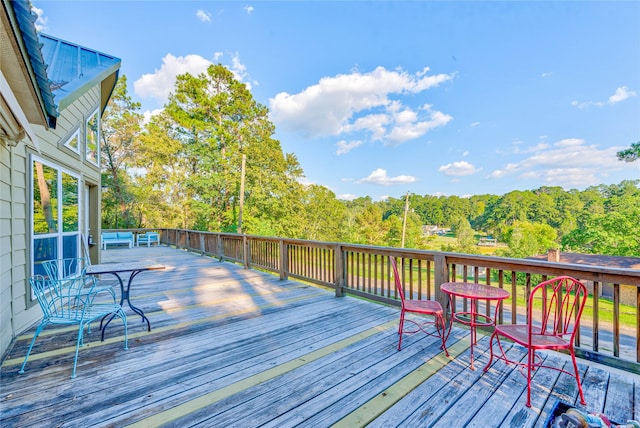 deck featuring a view of trees