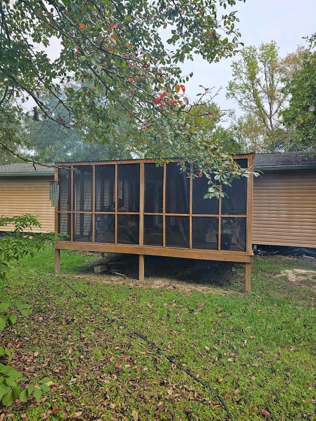 exterior space featuring a sunroom