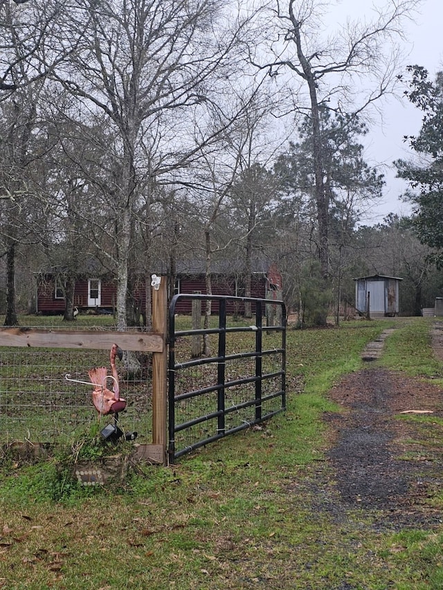 view of gate with an outdoor structure