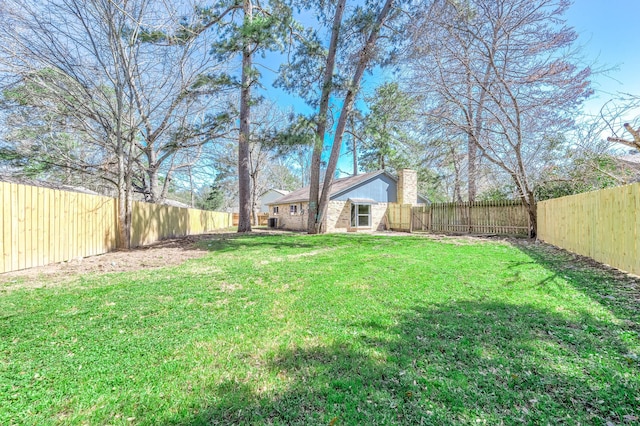 view of yard featuring a fenced backyard