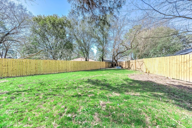 view of yard featuring a fenced backyard