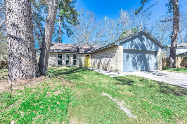 mid-century inspired home with a garage, brick siding, fence, concrete driveway, and a front yard