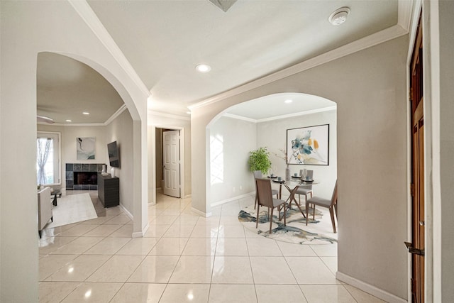 entryway featuring light tile patterned floors, recessed lighting, a tile fireplace, and baseboards