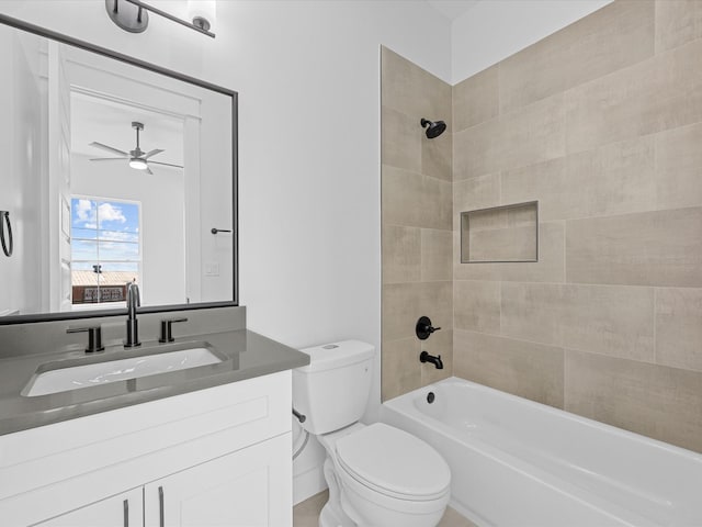 bathroom with bathtub / shower combination, vanity, toilet, and a ceiling fan