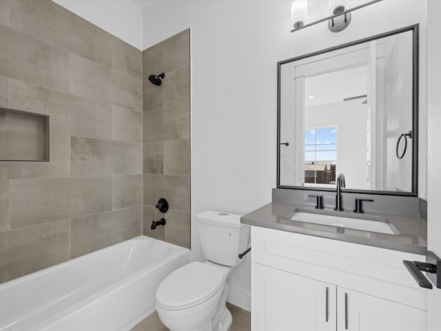 bathroom featuring tub / shower combination, vanity, and toilet