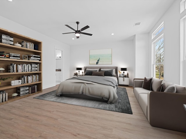 bedroom featuring recessed lighting, wood finished floors, a ceiling fan, visible vents, and ensuite bath