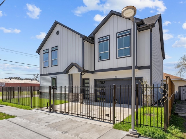 view of front of house with a fenced front yard, a garage, driveway, and board and batten siding