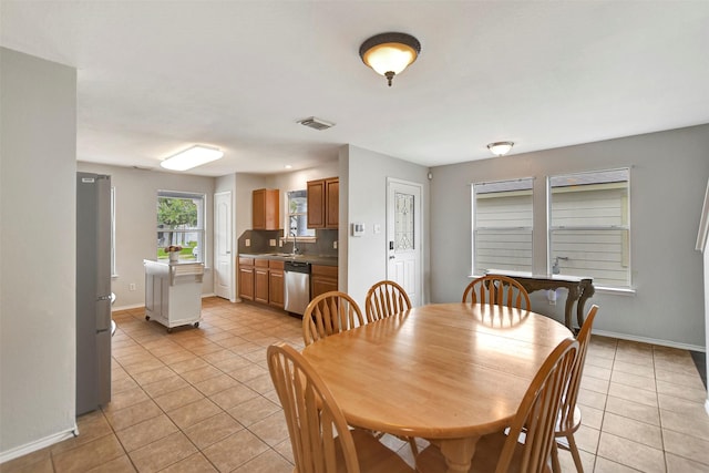 dining room featuring visible vents, baseboards, and light tile patterned floors