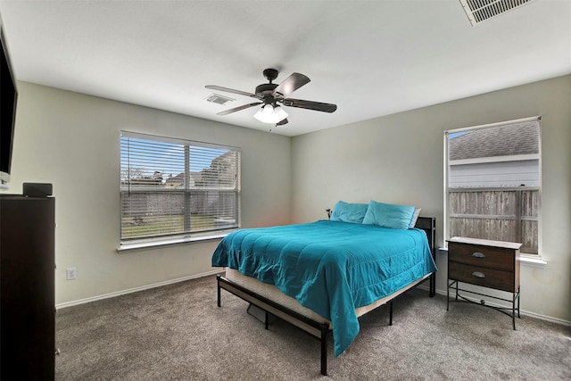 bedroom with carpet floors, visible vents, and baseboards